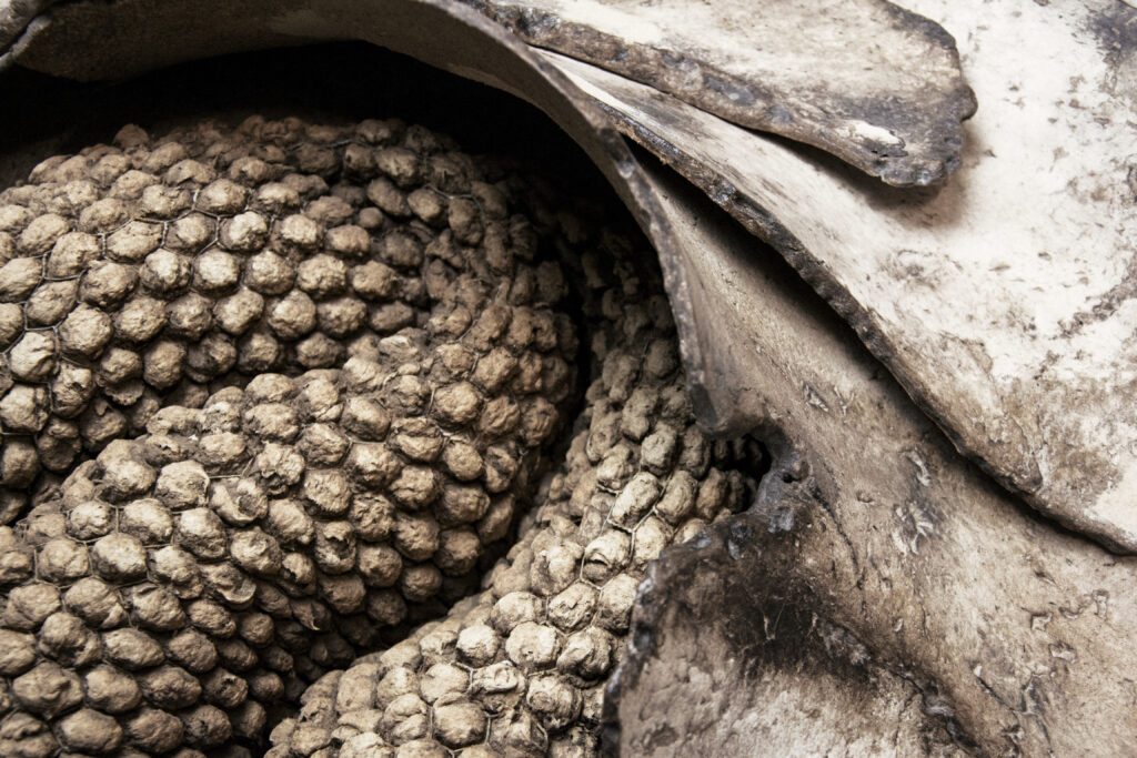 Sculptural artwork shaping the perception of space through texture and relief.