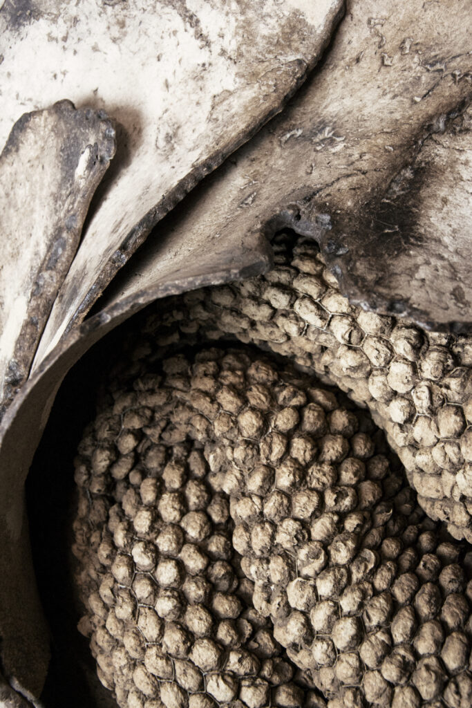 Paper sculpture artist Sandy Pouget creating textured sculptural relief