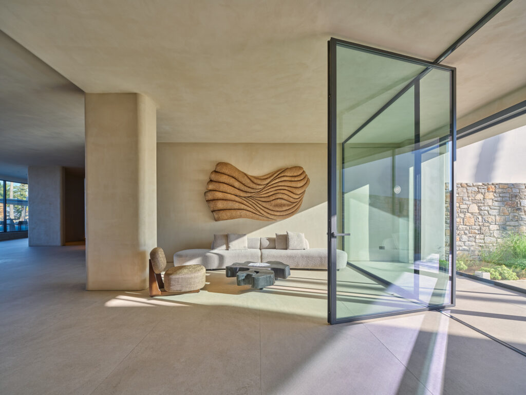 Sculptural wall installation with mineral-inspired textures in a hotel lobby