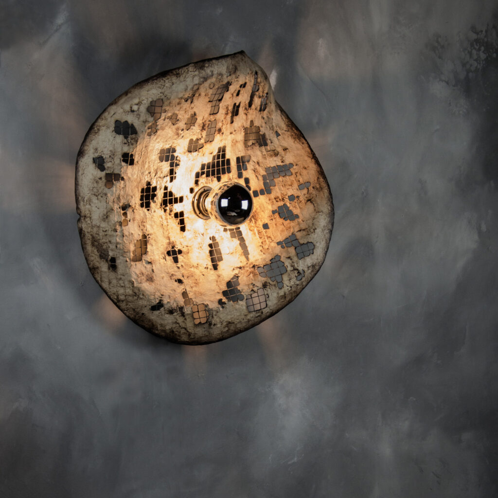 Wall sculpture with light inspired by urbex landscapes and tactile relief studies