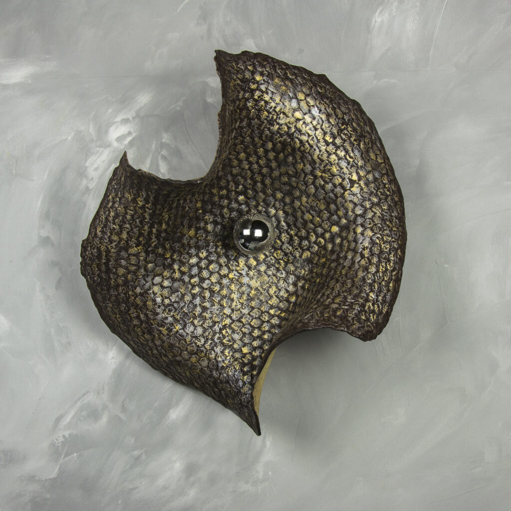 Illuminated relief inspired by an organic, tactile patterns that feel both ancient and alive, to play withe the interior architecture.