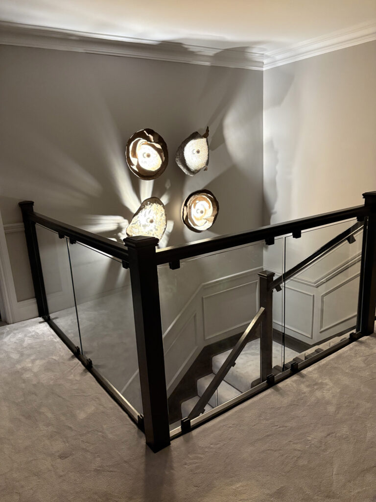 Wall sculpture with light playing with textures and reliefs in architectural interior