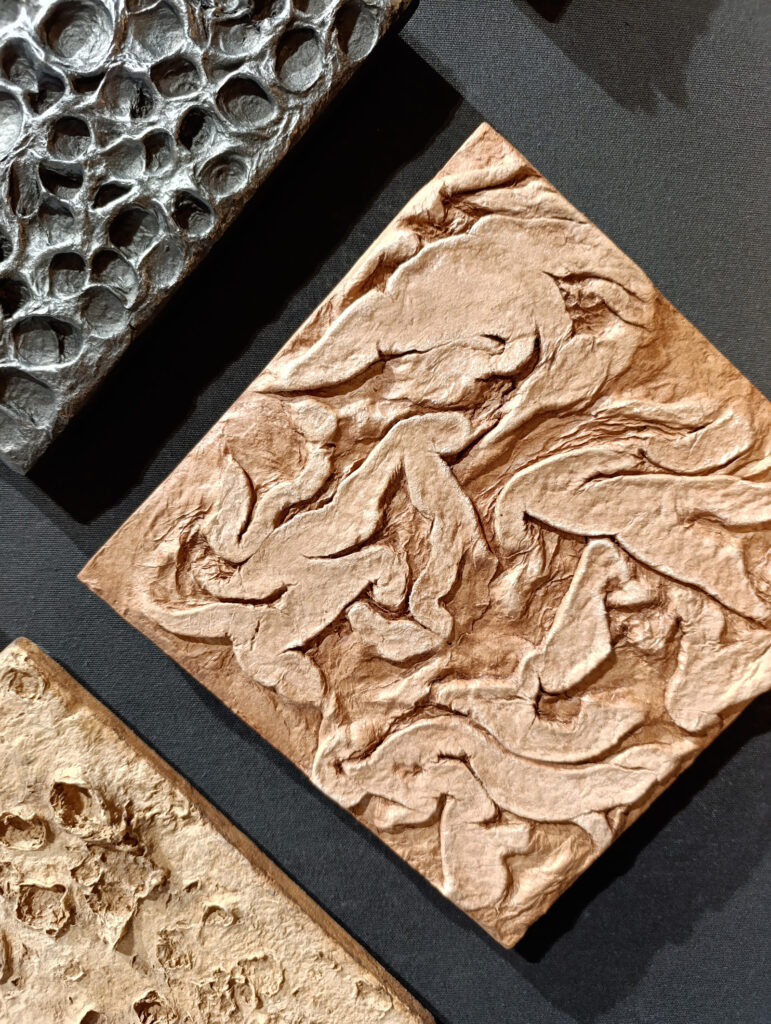 Flowing sculptural relief exploring movement beneath the surface.