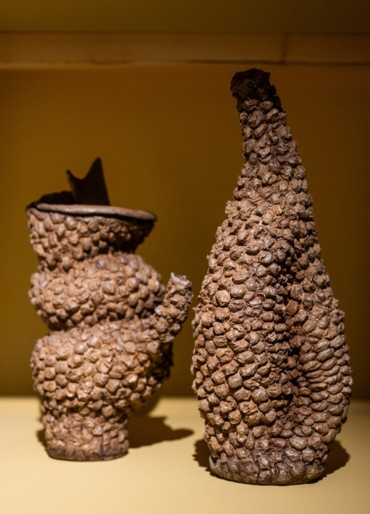 Sculptural relief interacting with natural light across textured surfaces.