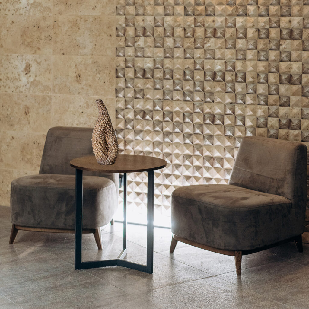 Sculptural object shaping the perception of space through texture and relief.