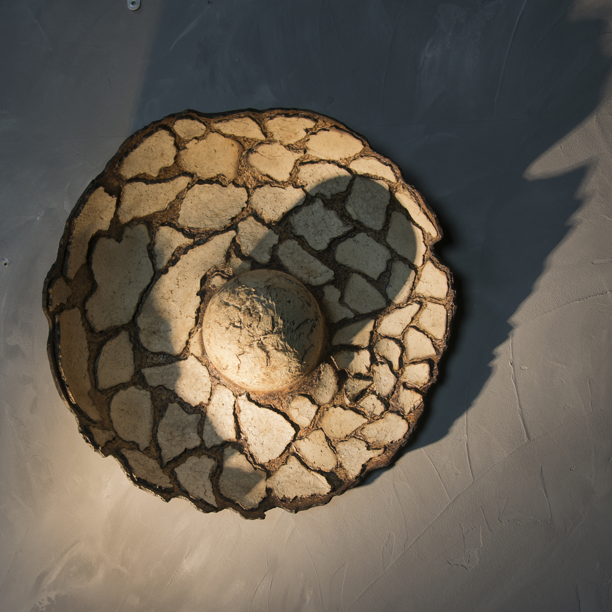 Sculptural work with raw textures inspired by imaginary terrains and fictional mineral landscapes linking texture, space and perception